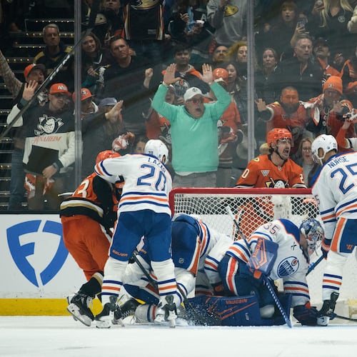 Anaheim Ducks left wing Chris Kreider, top center, reacts on the game-winning, overtime goal by center Ryan Poehling, not shown, in Game 4 in the first round of an NHL hockey Stanley Cup playoff series against the Edmonton Oilers, Sunday, April 26, 2026, in Anaheim, Calif. (AP Photo/Kyusung Gong)