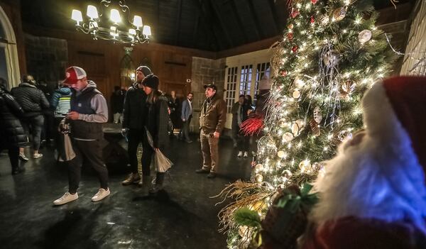 Voters lined up to cast their ballots at Park Tavern in Atlanta on Tuesday, Dec. 6, 2022.