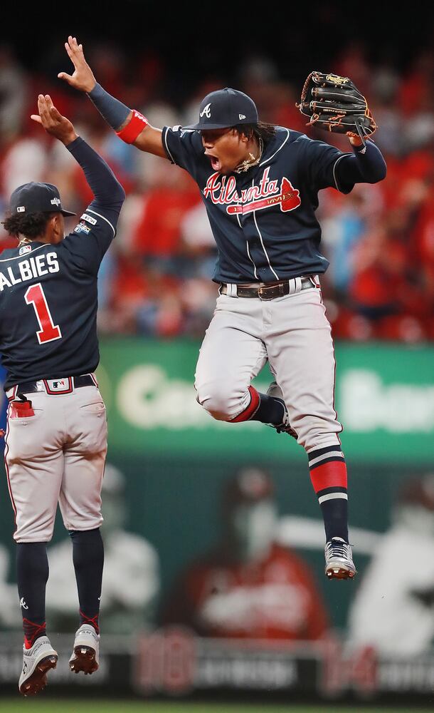 Photos: Braves win in dramatic fashion, lead Cardinals 2-1 in NLDS