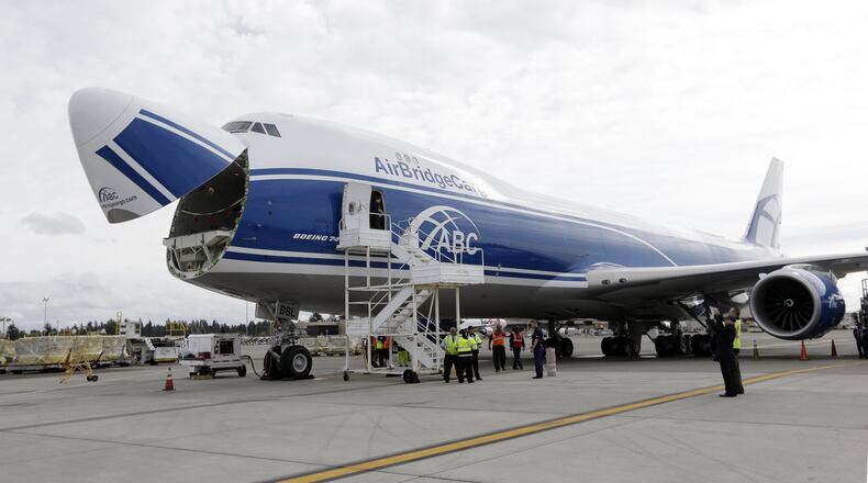 A new AirBridgeCargo Boeing 787-8 freighter in Seattle, just after delivery from Boeing. UPS is buying 14 of the enlarged 747s, with options for 14 more. (AP Photo/Elaine Thompson)