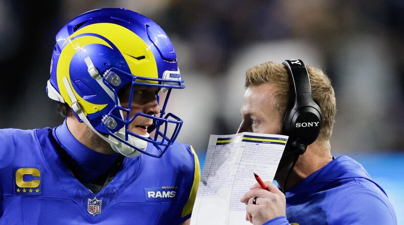 Los Angeles Rams head coach Sean McVay talks with quarterback Matthew Stafford, left, during the first half of an NFL football game Thursday, Dec. 18, 2025, in Seattle. (John Froschauer/AP)