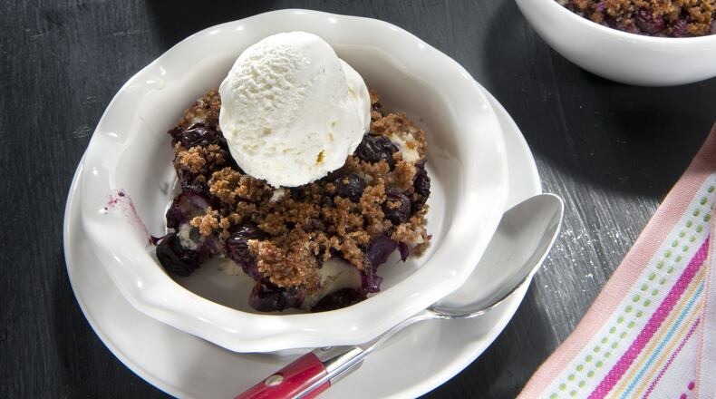 Try Lemon Blueberry Brown Betty topped with a scoop of frozen nonfat yogurt ice. (Tammy Ljungblad/Kansas City Star/TNS)