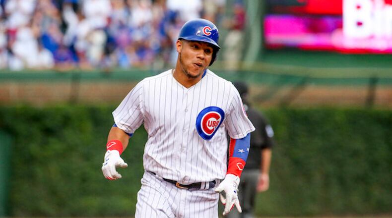 Chicago Cubs catcher Willson Contreras runs to third base after hitting a home run against the Washington Nationals on August 6, 2017, at Wrigley Field in Chicago. (Armando L. Sanchez/Chicago Tribune/TNS)