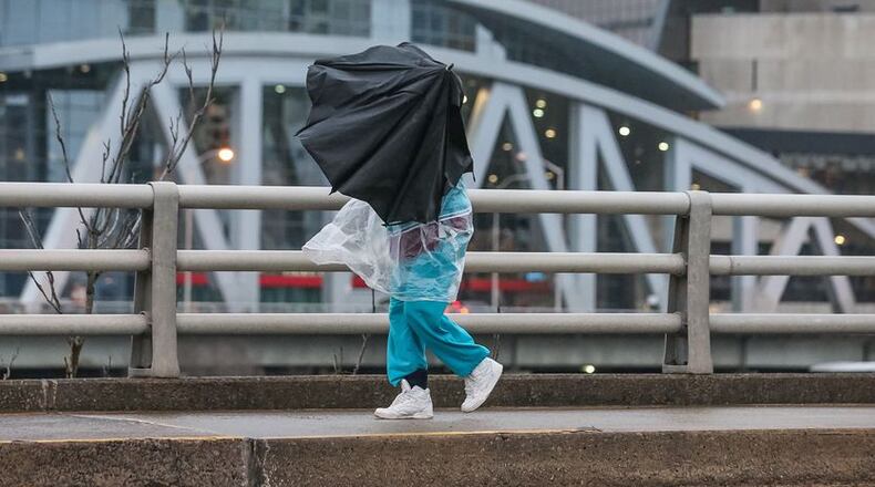 As rain slowed, winds picked up Friday morning in Atlanta. JOHN SPINK / JSPINK@AJC.COM