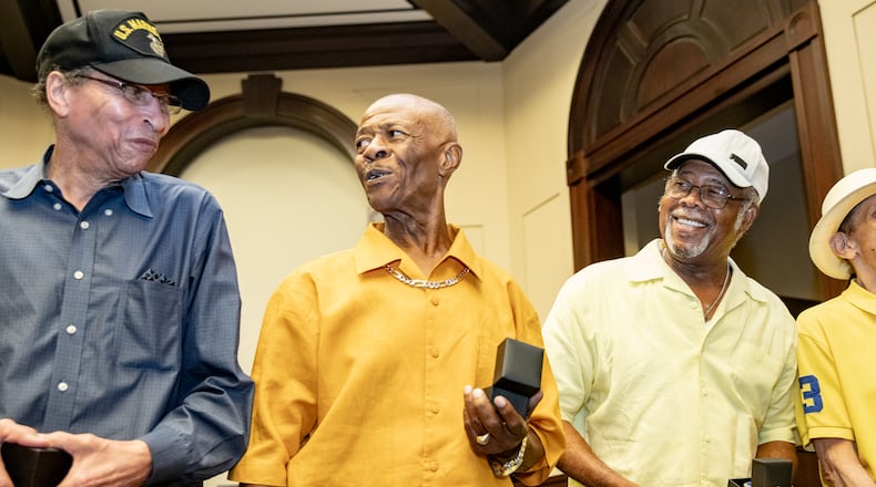 The Bailey-Johnson High School's basketball team of 1964-65, including James Emerson, Jimmy Taylor and David Taylor, receive their State Championship rings on Monday, July 17, 2023 at Alpharetta City Hall during a city council meeting. (Jenni Girtman for The Atlanta Journal-Constitution)