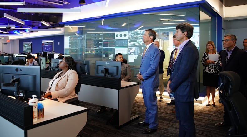 Gov. Brian Kemp tours Equifax’s new “Global Fusion Center” with Equifax CEO Mark Begor. Elijah Nouvelage for The Atlanta Journal Constitution