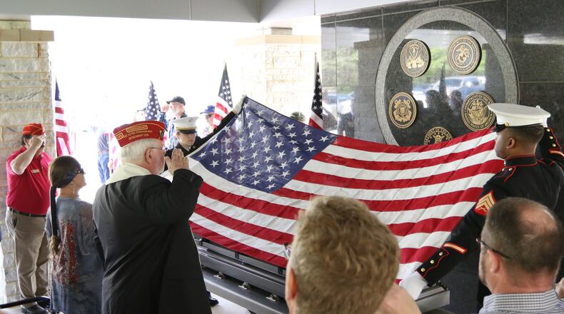 No family members claimed Vinings resident Richard Lindsay Butterfield’s remains. But on Wednesday dozens of volunteers and friends held a funeral for the Vietnam War veteran at Georgia National Cemetery, complete with a gun salute and taps. EMILY HANEY / emily.haney@ajc.com