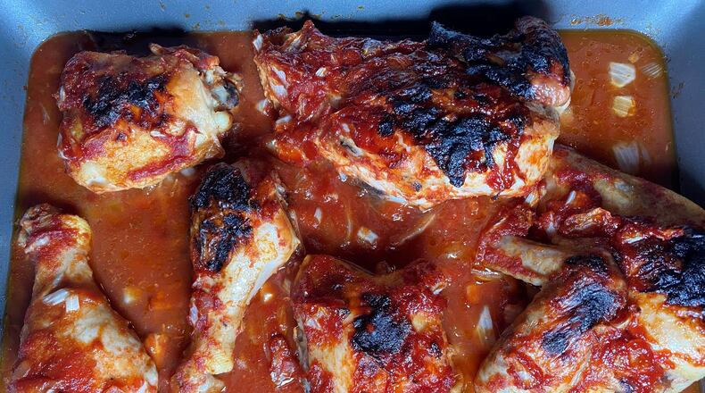 Oven-baked barbecued chicken was a favorite that the late John Lewis made in a large pan at Christmastime. Bob Townsend for The Atlanta Journal-Constitution.