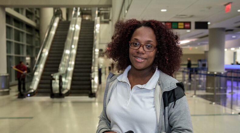 Vernetta Jackson works the overnight shift at the Hartsfield-Jackson International Airport for Enterprise Rent-A-Car so she can go to school during the day and spend time with her 6-month-old baby. STEVE SCHAEFER / SPECIAL TO THE AJC