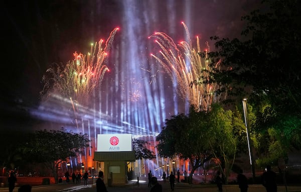 Fireworks are launched for the first graduation for The American University of Iraq - Baghdad in Baghdad, Iraq, Saturday, May 24, 2025. (AP Photo/Hadi Mizban)