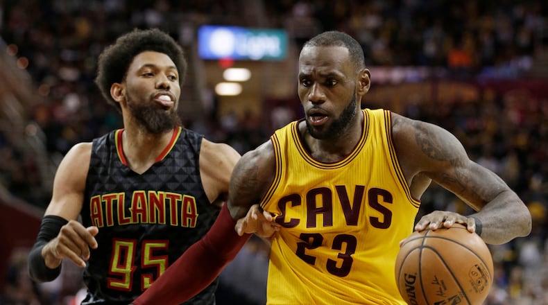 Cleveland Cavaliers' LeBron James (23) drives around Atlanta Hawks' DeAndre Bembry (95) in the second half of an NBA basketball game, Friday, April 7, 2017, in Cleveland. (AP Photo/Tony Dejak)