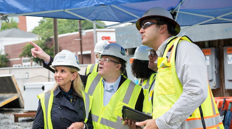 Louise Samsky (from left), Brett Samsky and Connor Samsky with David Hajjar, senior project manager for Brasfield & Gorrie, on-site at the Piedmont Atlanta Tower under construction. CONTRIBUTED