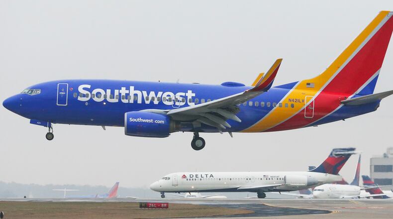 Hartsfield-Jackson International Airport: A Southwest jet takes off. JOHN SPINK / JSPINK@AJC.COM