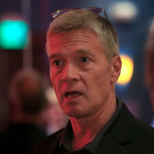 FILE - Republican 3rd district congressional candidate Greg Goode talks with supporters at a Johnson County Republican election watch party in Overland Park, Kan., Aug. 2, 2016. (AP Photo/Orlin Wagner, File)