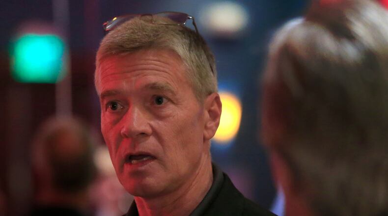 FILE - Republican 3rd district congressional candidate Greg Goode talks with supporters at a Johnson County Republican election watch party in Overland Park, Kan., Aug. 2, 2016. (AP Photo/Orlin Wagner, File)