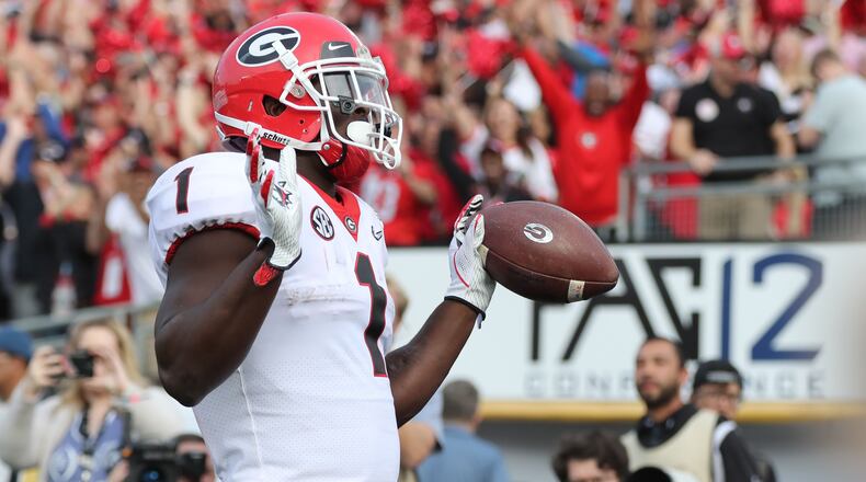 Georgia Bulldogs running back Sony Michel (1) scores Georgia's first TD in the first quarter at the College Football Playoff Semifinal at the Rose Bowl Game on Monday, January 1, 2018, in Pasadena.    Curtis Compton/ccompton@ajc.com