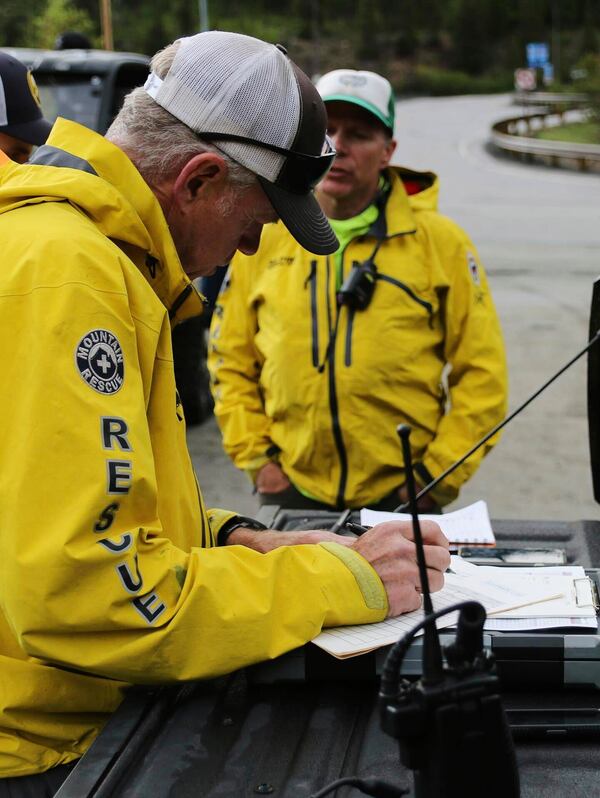 In this image provided by the Alpine Rescue Team, Alpine Rescue Team members take part in helping get two men struck by lightning off Torreys Peak in Colorado, Thursday, June 12, 2025. (Jake Smith/Alpine Rescue Team via AP)