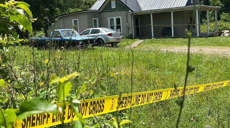The dilapidated home where authorities say they removed 16 children and arrested four adults remains blocked off by crime scene tape on Wednesday, July 1, 2026 in Hamden, Ohio. (AP Photo/Julie Carr Smyth)
