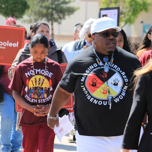 FILE - Tize W. Clark, right and his son, Zion Clark, participate in a walk to honor Native American and Indigenous relatives who have gone missing or have been killed as Missing and Murdered Indigenous Persons Awareness Day is marked in Albuquerque, New Mexico, on May 5, 2025. (AP Photo/Susan Montoya Bryan,File)