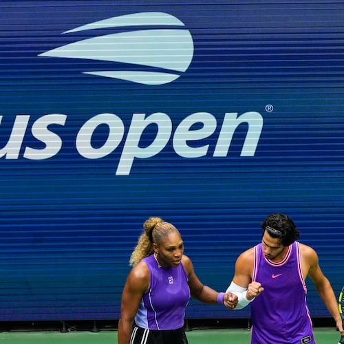 Serena Williams, of the United States, and Carlos Alcaraz, of Spain, react during a mixed doubles match at the U.S. Open tennis championships, Tuesday, Aug. 25, 2026, in New York. (AP Photo/Yuki Iwamura)