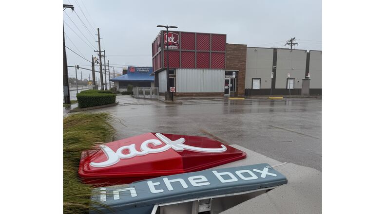 The sign in front of Jack In the Box, in Tamuning, Guam, sits on the ground, Tuesday, April 14, 2026, as a super typhoon with ferocious winds and heavy rains is battering a group of remote U.S. islands in the Pacific Ocean. (Eric Rosario/Kandit News via AP)