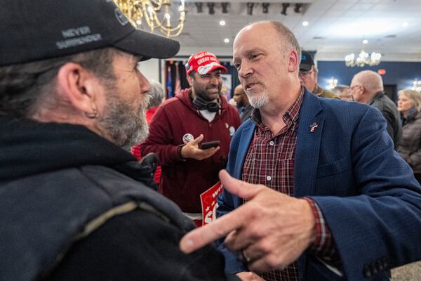 Wisconsin Supreme Court candidate Brad Schimel, right, talks to a supporter after a rally Saturday, March 29, 2025 on a campaign stop at the American Serb Memorial Hall in Milwaukee. (AP Photo/Andy Manis)