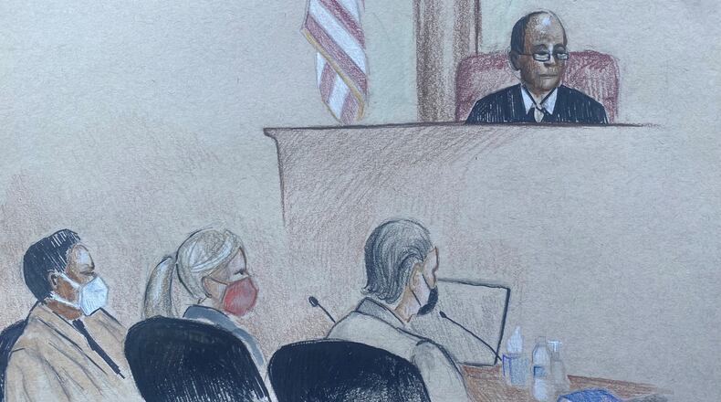 Mitzi Bickers (L) on Monday, March 14, 2022 with her defense lawyers, Marissa Goldberg and Drew Findling. United States District Court Judge Steve C. Jones looks on.