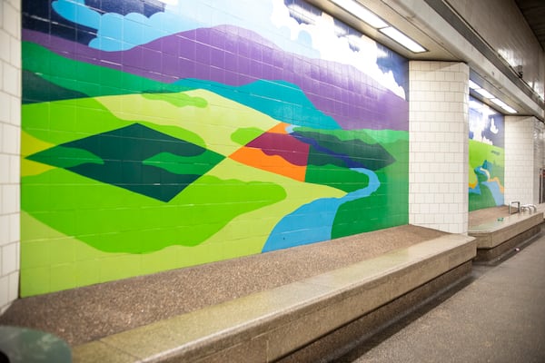 Landscape murals by Gordon Anderson greet passengers at the North Avenue MARTA Station platform. “I wanted the commuters to experience the distorted sensations of a pilot flying into the (station),” Anderson says. 
(Courtesy of MARTA)