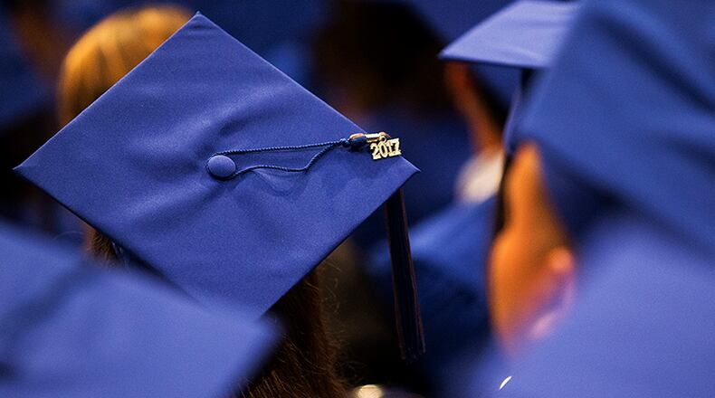 A 2017 charm sits on top of a graduate's hat during McCallum High School's commencement ceremony at the Erwin Center in Austin on Thursday, June 1, 2017. NICK WAGNER/AMERICAN-STATESMAN