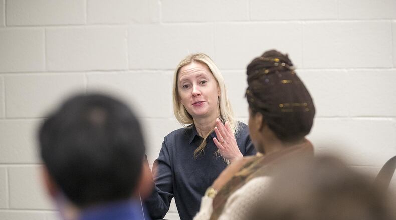 Susan Thomas (center), associate professor at the George W. Woodruff School of Mechanical Engineering at Georgia Tech, encourages her students to discuss their ideas during an Advanced Biomaterials class at the Howey Physics Building on the university’s main campus in Atlanta on Jan. 22. ALYSSA POINTER / ALYSSA.POINTER@AJC.COM