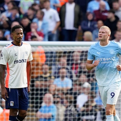 Manchester City's Erling Haaland, right, celebrates after scoring his side's opening goal during the English Premier League soccer match between Manchester City and Coventry City in Manchester, England, Saturday, Sept. 5, 2026. (AP Photo/Dave Thompson)