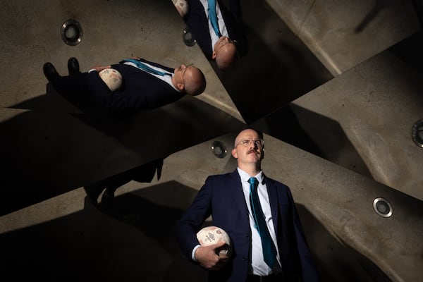 Michael Collins, former Color Of Change director, poses for a portrait at the soccer ball sculpture at Mercedes-Benz Stadium in Atlanta on Tuesday, September 9, 2025. He’s leading a new coalition, Play Fair ATL, to hold Atlanta accountable on human rights ahead of the 2026 World Cup. (Arvin Temkar/AJC)