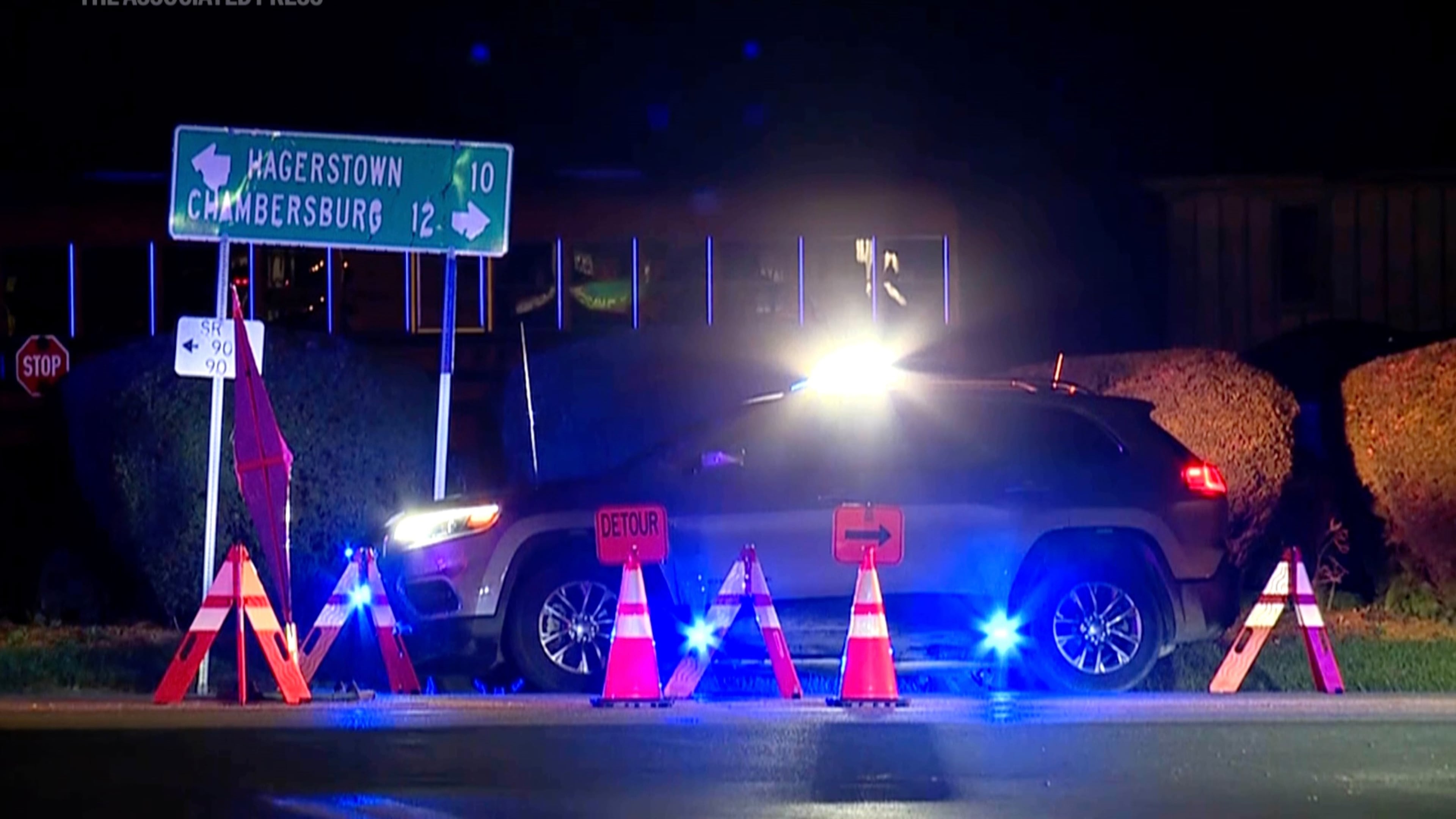 A police vehicle is seen at the site where two state police officers and a suspect were shot while officers were responding to a call, in southern Franklin County, about 85 miles (135 kilometers) northwest of Baltimore, Pa, Wednesday, Oct. 8, 2025. (WPMT/FOX43 via AP)