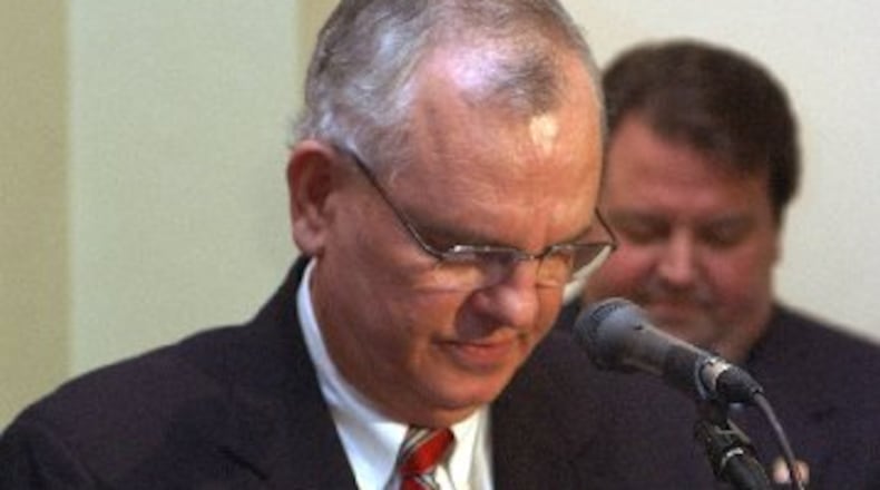 Rev. Sam Storey led the prayer when Gov. Roy Barnes' official portrait was unveiled in 2003. AJC file photo: Jean Shifrin