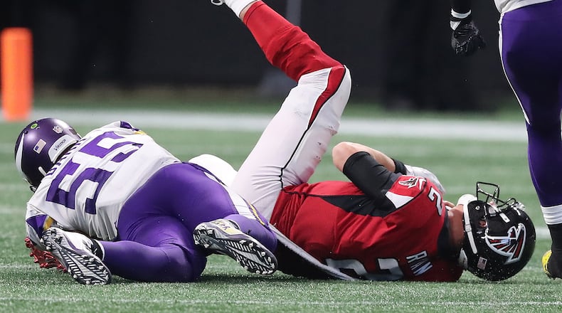 Falcons quarterback Matt Ryan is tackled by Minnesota linebacker Anthony Barr in the second half Sunday. The Falcons lost 14-9.