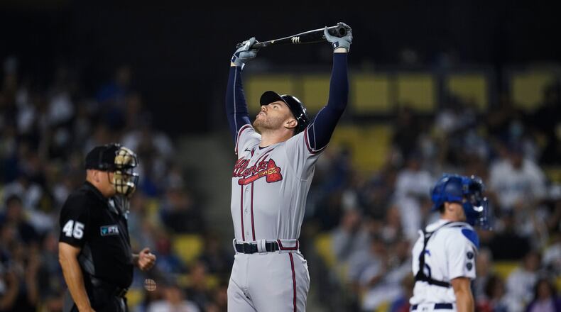 Atlanta Braves' Freddie Freeman reacts after striking out during the eighth inning of the team's baseball game against the Los Angeles Dodgers on Tuesday, Aug. 31, 2021, in Los Angeles. (AP Photo/Marcio Jose Sanchez)