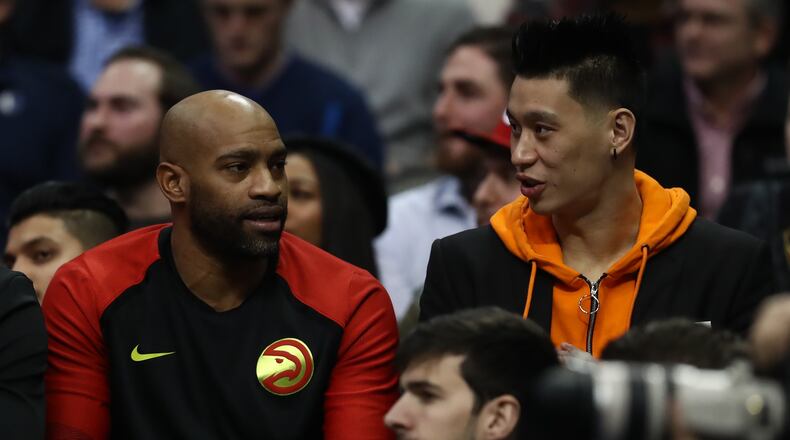 Vince Carter (left) talks with Jeremy Lin during play against the Dallas Mavericks at American Airlines Center on Dec. 12, 2018 in Dallas, Texas.