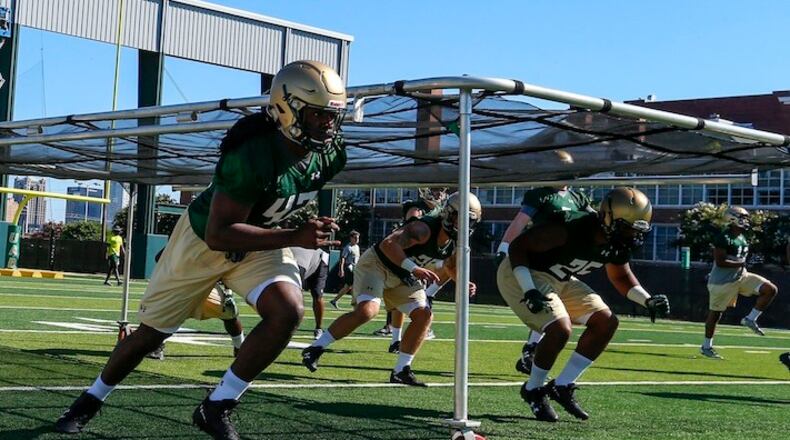 Shaq Jones (42) runs through drills during the first practice as UAB's football program starts up again after two years, Monday, July 31, 2017, in Birmingham, Ala. (AP Photo/Butch Dill)