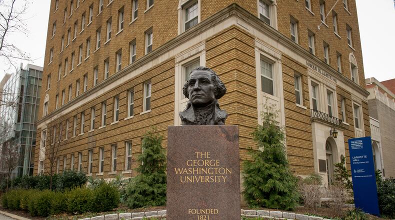 George Washington University said Thursday that it was looking into a blog post, written under the name of an associate professor of history, saying she had engaged in a yearslong deception by assuming various Black identities even though she is white.