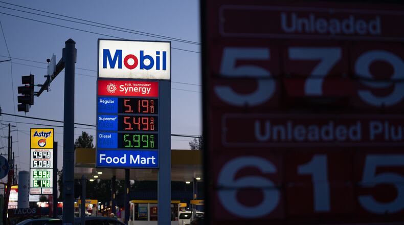 Gasoline prices are displayed at a Mobil gas station on Wednesday, April 29, 2026, in Portland, Ore. (AP Photo/Jenny Kane)