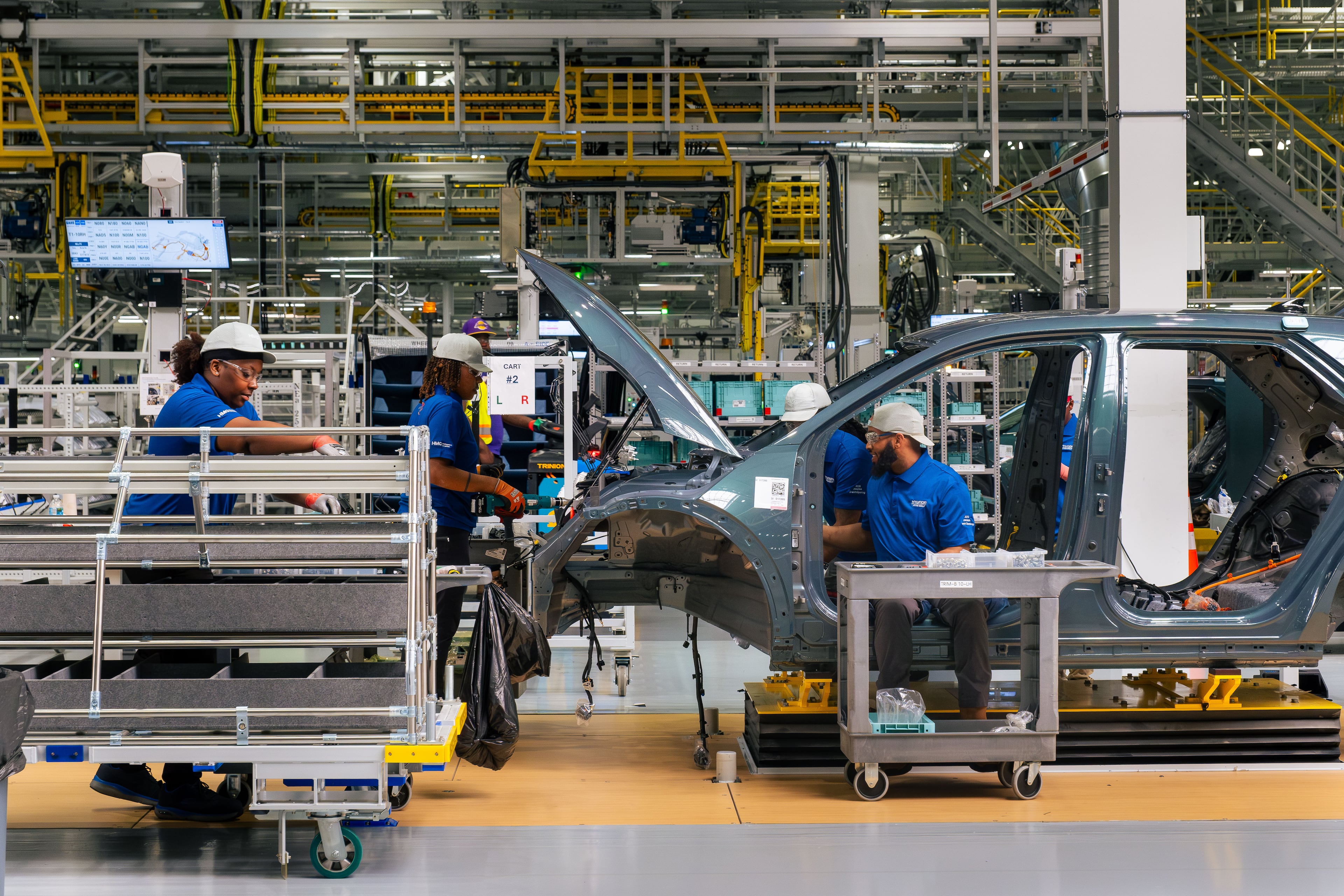 Metapros assemble parts on the IONIQ 5 electric car at the Hyundai Metaplant in Bryan County, Georgia, on March 26, 2025. (Justin Taylor/The Current GA)