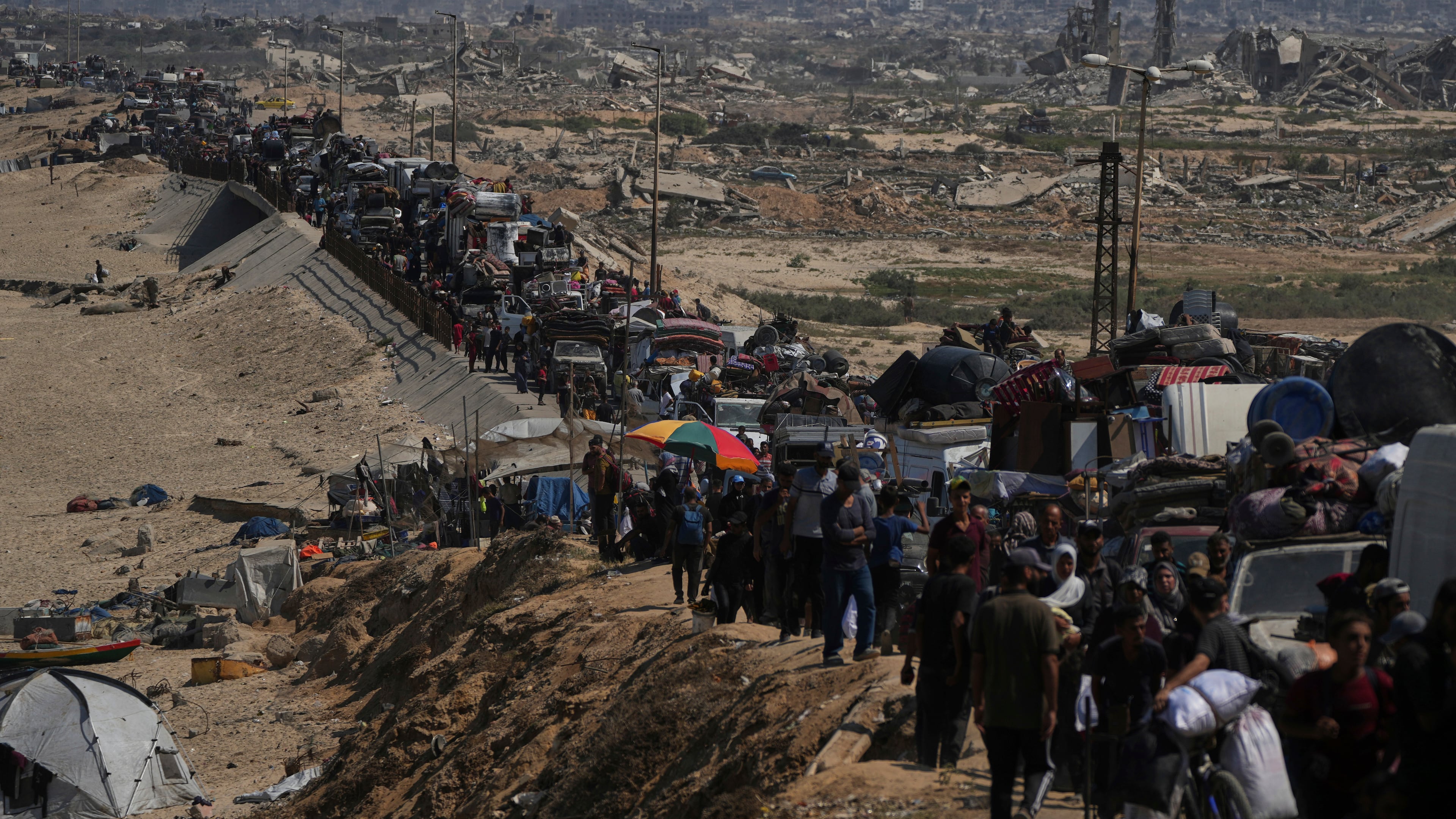 Displaced Palestinians flee northern Gaza along the coastal road toward the south, after Israel's military says its expanded operation in Gaza City has begun and warns residents to leave, Tuesday, Sept. 16, 2025. (AP Photo/Abdel Kareem Hana)