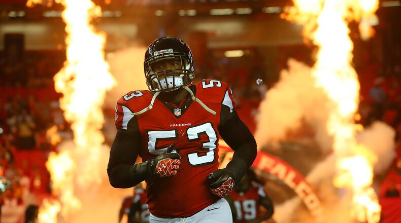 Exonerated Falcons linebacker Brian Banks takes the field through the flames for a NFL preseason game against the Jaguars.