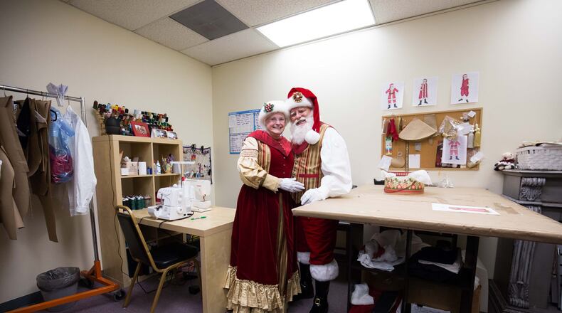 Loretta and Lou Knezevich, dressed as Santa and Mrs. Claus, pose at J&R Santaprises in Marietta. CONTRIBUTED BY BRANDEN CAMP