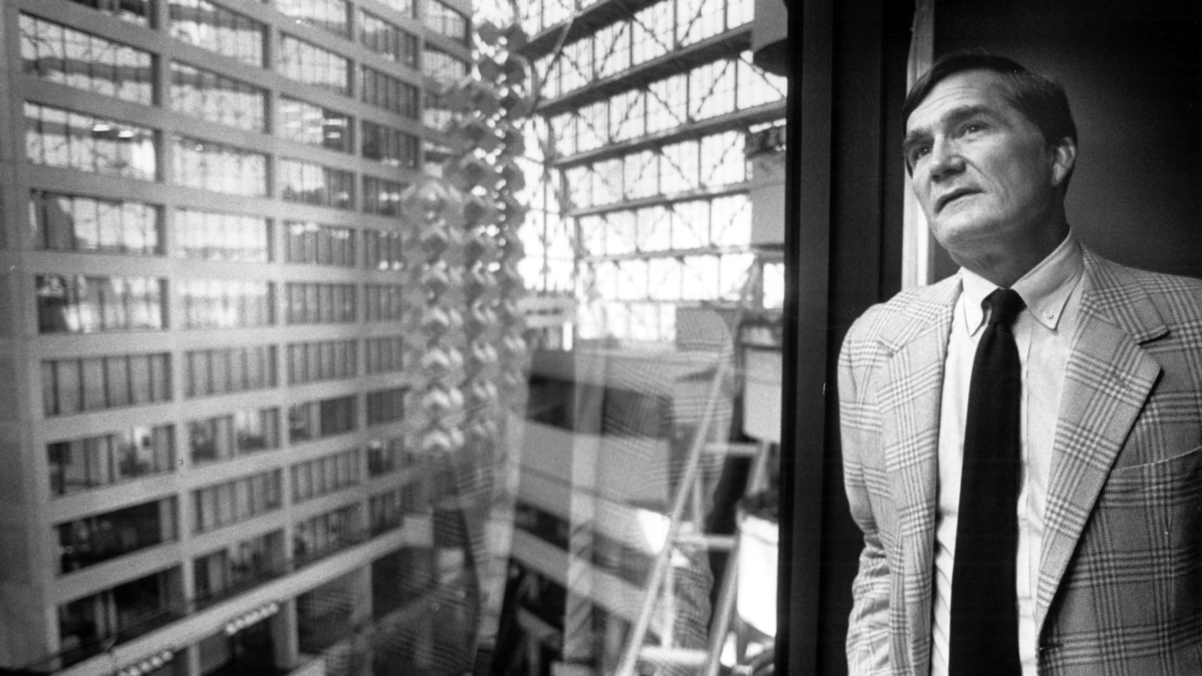 Tom Cousins, then president and CEO of Cousins Properties, looks out from his office to the former CNN Center. Cousins built the property as one of his many Atlanta development projects. (Andy Sharp/AJC FILE)