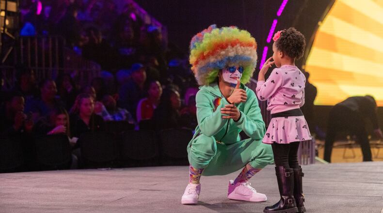 A UniverSoul Circus clown gives a young audience member a thumbs up during an early show for its 30th anniversary year.
