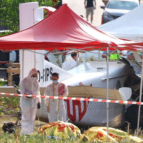 Forensic technicians examine a skydiving plane that crashed in Tomblaine northeastern France, killing all 11 people on board, Sunday, June 28, 2026. (AP Photo/Antonin Utz)