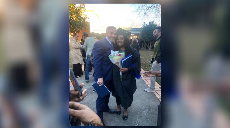 Latonya Young and Kevin Esch pose for a picture at a December 2019 ceremony in which she received a criminal justice degree from Georgia State University. Esch, who met Young a year earlier when he was an Uber passenger in her vehicle, paid a student debt for her. CONTRIBUTED.