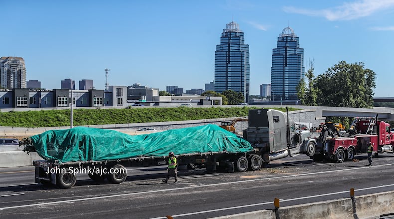 A truck carrying landscaping supplies crashed on I-285 near Ga. 400 during Wednesday's morning commute.