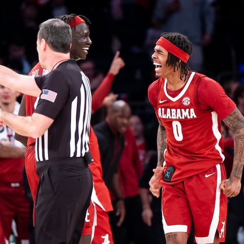 Alabama forward Taylor Bol Bowen (7) and guard Labaron Philon (0) celebrate a basket near the end of an NCAA college basketball game against St. John's, Saturday, Nov. 8, 2025, in New York. (AP Photo/Angelina Katsanis)